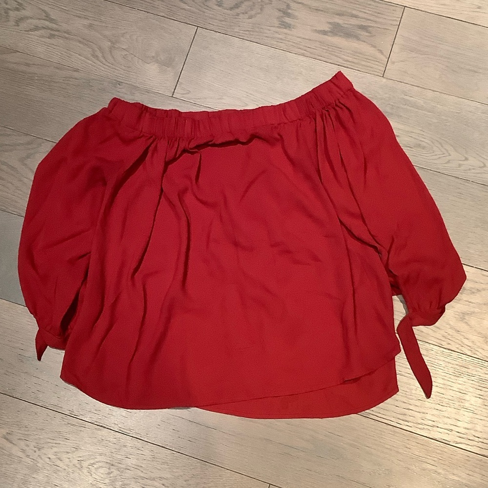 Express Vibrant Red Off-Shoulder Blouse with ties at the cuffs.